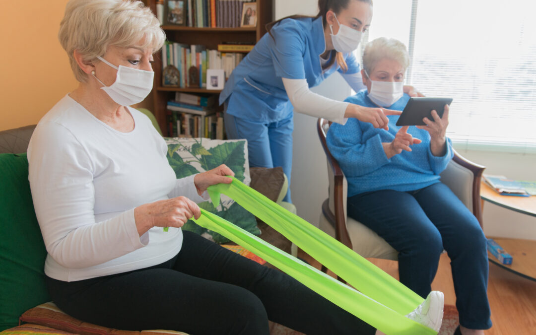 Geriatric nurse wearing a facemask while assisting senior women at a retirement home