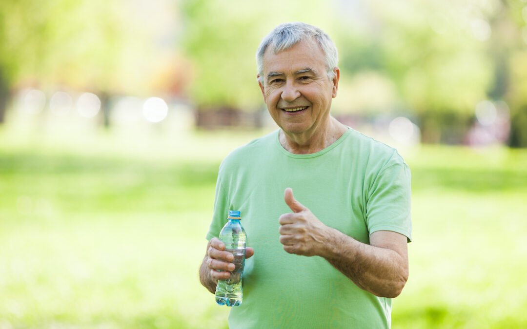Senior,Man,Is,Drinking,Water,After,Workout,In,Park.